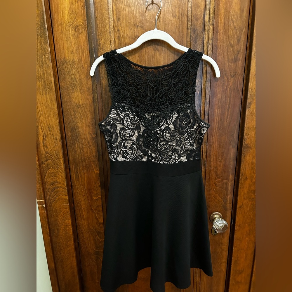 Black lace dress from Macy’s with thick black lining and nude liner.
